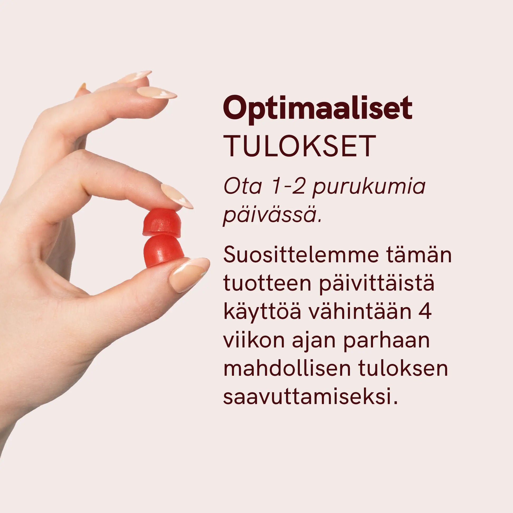 Käsi, joka pitää kaksi punaista purukumia vaaleanpunaisella taustalla.