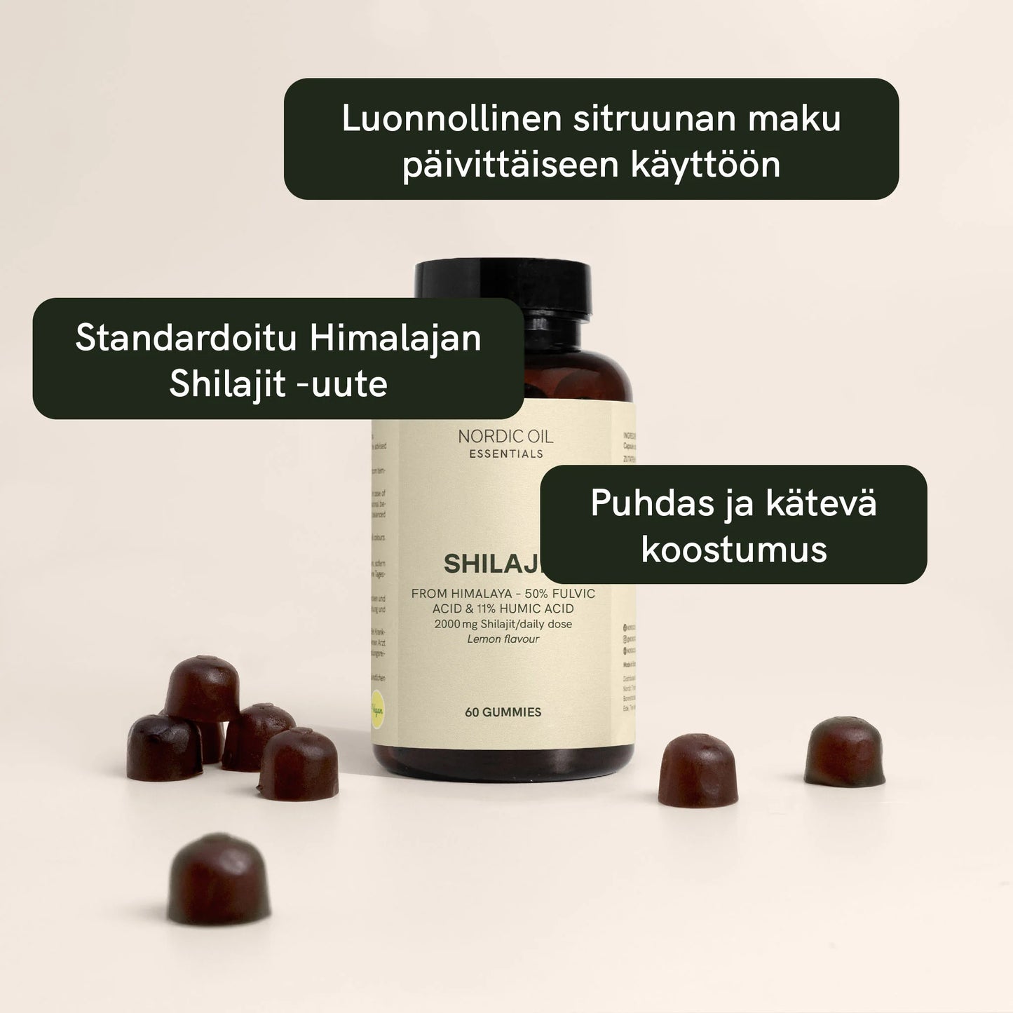 Nordic Oil Essentials Shilajit -pullo ja ruskeita gummimakeisia pöydällä, sitruunan maku
